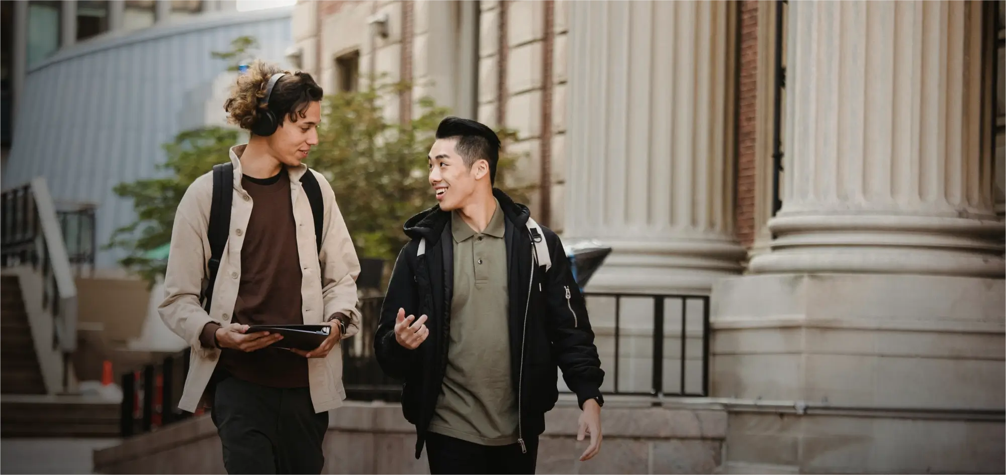 Two Woolf students walking together on a university campus